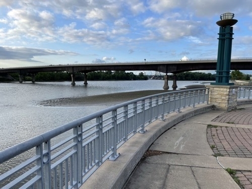 Photo of linear riverfront park with bridge over the Mississippi River in downtown Mokine Illinois